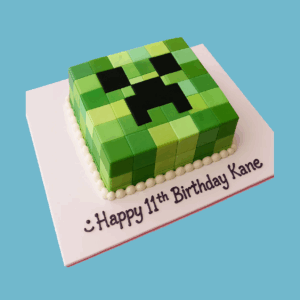 A square Minecraft Creeper Cake designed with pixelated green fondant in varying shades to replicate the character’s blocky look. The cake features the Creeper’s signature black square eyes and mouth, accurately capturing the iconic face from the game. Its clean lines and bold colours reflect the original Minecraft graphics, making it a standout centrepiece for themed birthdays and gaming celebrations.