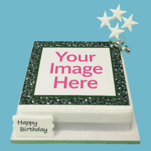 A round personalised cake covered in smooth white fondant with scalloped edges. The cake features a central edible photo framed by a glittery border, giving it a sparkling, standout look. A silver ribbon wraps around the base, and silver star toppers add a festive touch. A message plaque sits on top for custom text. Elegant and customisable, ideal for celebrations like birthdays, anniversaries, or baby showers.