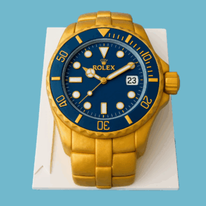 A detailed cake shaped like a gold Rolex wristwatch with a deep blue watch face featuring time markers and realistic hands. The gold strap wraps around the base, showing finely detailed polished links. The cake is crafted with precision, including the bezel, crown logo, and textured band. It serves as an elegant and eye-catching centerpiece suitable for milestone birthdays, retirements, or luxury-themed celebrations.